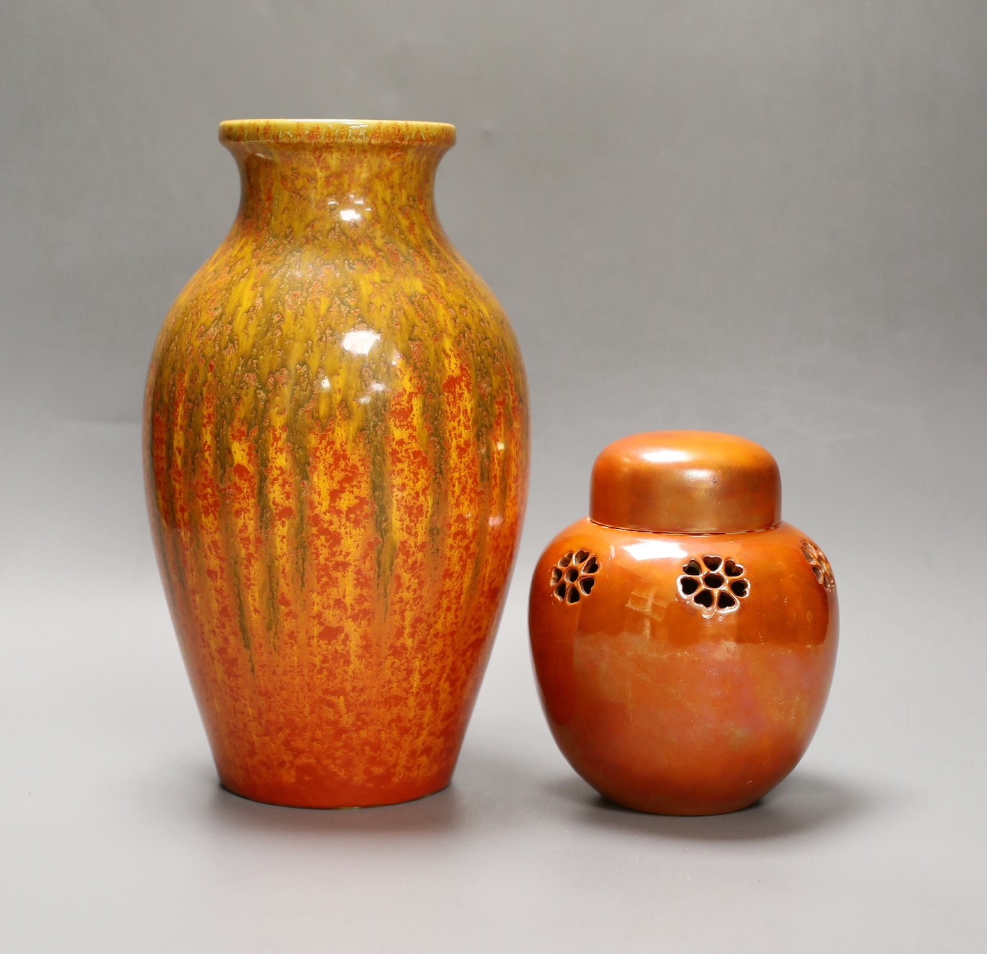 A Pilkington‘s Royal Lancastrian mottled orange ground vase and a Ruskin Orange lustre jar and cover, dated 1914, tallest 25cm
